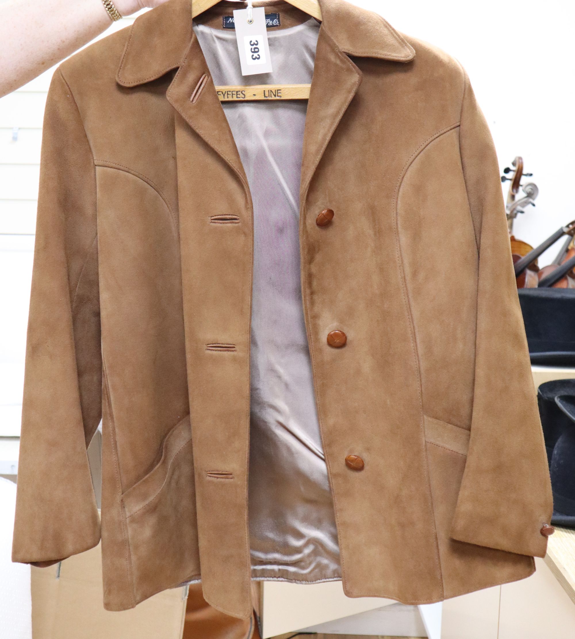 A light tan 1960s suede jacket and a similar chocolate brown jacket